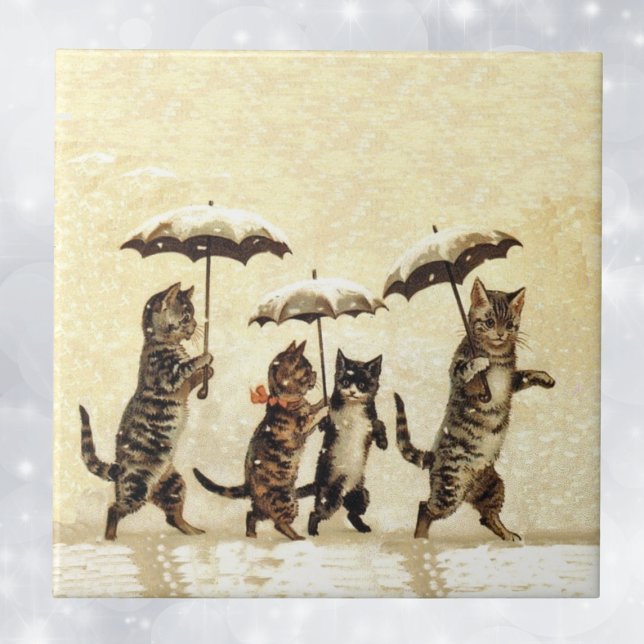 Carreau Chats vintages Parapluies Dansant Neige (Four brown striped cats walking upright with umbrellas in snow on decorative tile.)