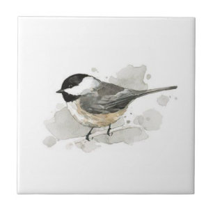 Carreau Chicadee sur une tuile en céramique blanche