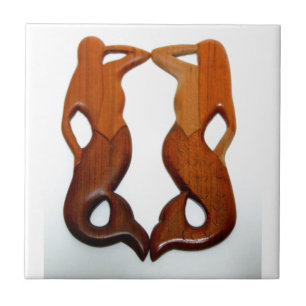 Carreau deux sirènes en bois sculpté