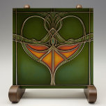 Carreau Emerald Grace Art Nouveau<br><div class="desc">Inspirez votre maison de l'élégance intemporelle du "Carrelage en céramique Emerald Grace Art Nouveau", une pièce étonnante qui incarne la fluidité et la beauté organique du mouvement Art Nouveau. Ce carrelage en céramique, imprimé par Zazzle, présente un design captivant avec des lignes fluides et un motif central dans des tons...</div>