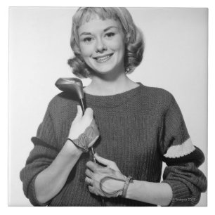 Carreau Femme tenant le club de golf