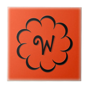 Carreau Fleur noire monogrammée sur orange Tango