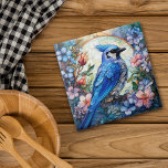 Carreau Floral rose Bleu Jay Vitrail<br><div class="desc">Sur ce carrelage en céramique,  une belle baie bleue perche dans un cercle de ciel clair. Le cercle et l'oiseau sont entourés et recouverts de fleurs et de bourgeons bleu pastel,  rose et orange. Une superposition a été ajoutée pour donner un aspect de vitrail. Joli !</div>