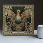 Carreau Hommage mystique à la tribu des colibris<br><div class="desc">Entrez dans un royaume où le physique et spirituel convergent avec notre "Carrelage en céramique pour bijoux tribaux mystiques". Inspiré par une fusion de styles d'art uniques - esthétique tribale, optimisme joyeux, rébellion punk tapis, et harmonie symétrique, ce carreau résonne d'un riche récit visuel. Le motif principal est un colibri,...</div>