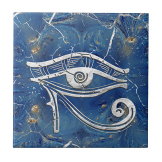 Carreau Œil d'Horus égyptien en argent sur marbre bleu