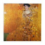 Carreau Portrait d'Adele Bloch-Bauer par Gustav Klimt<br><div class="desc">Gustav Klimt - Portrait d'Adele Bloch-Bauer 1907. Emplacement précédent de ce tableau : ancienne Galerie Österreichische dans le palais du Belvédère à Vienne. Ce tableau a été vendu pour 135 millions de dollars à Ronald S. Lauder, en 2006, qui l'a apporté à sa Neue Galerie à New York. C'était alors...</div>