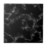 Carreau Tuile en marbre noir<br><div class="desc">Vous cherchez un tuile qui peut ajouter une touche élégante et sophistiquée à votre maison? Ne cherchez pas plus loin que notre Carrelage en marbre en noir et blanc classique. L'effet de marbre sur ce carrelage crée un sentiment de luxe intemporel et chic, tandis que les couleurs noir et blanc...</div>