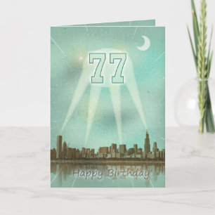 Carte 77e anniversaire avec une ville et des spots