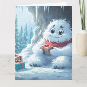 Carte Adorable Yeti avec cadeaux de Noël dans une grotte
