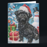 Carte Affenpinscher Winter Wonderland Christmas Joie<br><div class="desc">Ce design festif reflète l'esprit joyeux de la période des fêtes, avec un adorable petit portant un chapeau de Père Noël. Le chien est niché dans un pays des merveilles hivernales, avec un bonhomme de neige, un sapin de Noël décoré et des cadeaux joliment emballés. Les flocons de neige tombent...</div>