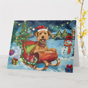 Carte Airedale dans un traîneau Noël enneigé