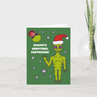 Alien spatial dans un chapeau de Père Noël personn