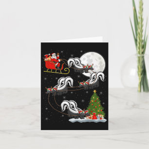 Carte Allumage du sapin de Noël Santa à cheval sur une m