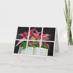 Carte Bible ouverte avec Poinsettias dans la fenêtre