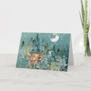 Carte Biche et faon dans une forêt enneigée sous la plei