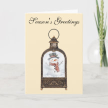 Bonhomme de neige dans une lanterne vintage
