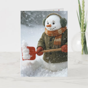 Carte Bonhomme de neige de Noël déblayant la neige