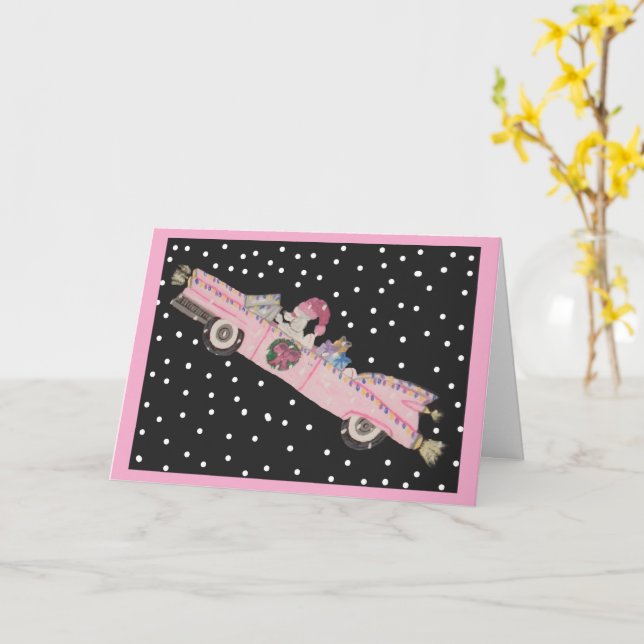 Carte Caniche à Noël dans une décapotable rose (Fleur jaune)