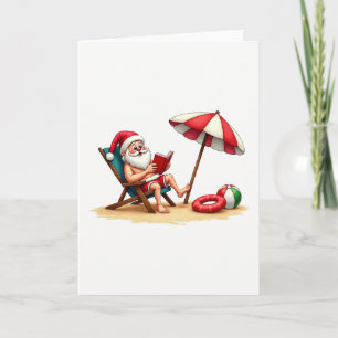 Carte Chaise de plage de Santa lisant un Noël tropical