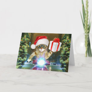 Carte Chat dans le chapeau du Père Noël livre un cadeau