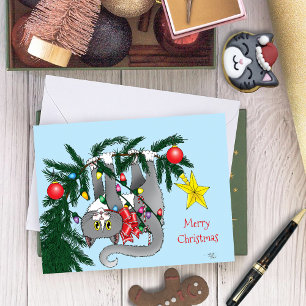 Carte Chat gris joueur suspendu à l'arbre de Noël