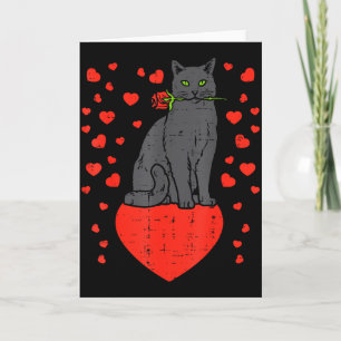 Carte Chat noir mordant des cœurs de rose pour la Saint-