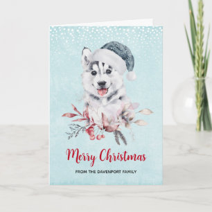 Carte Chien de Noël Husky dans un chapeau de Père Noël