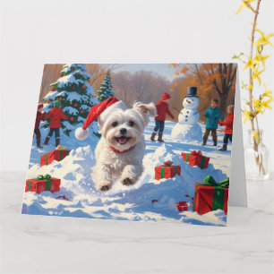 Carte Chien maltais courant dans la neige avec un chapea