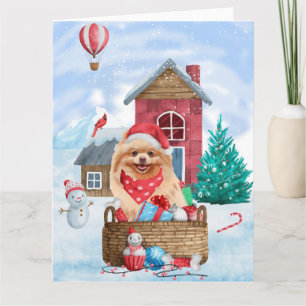 Carte Chien Pomeranian dans la maison de Noël enneigée