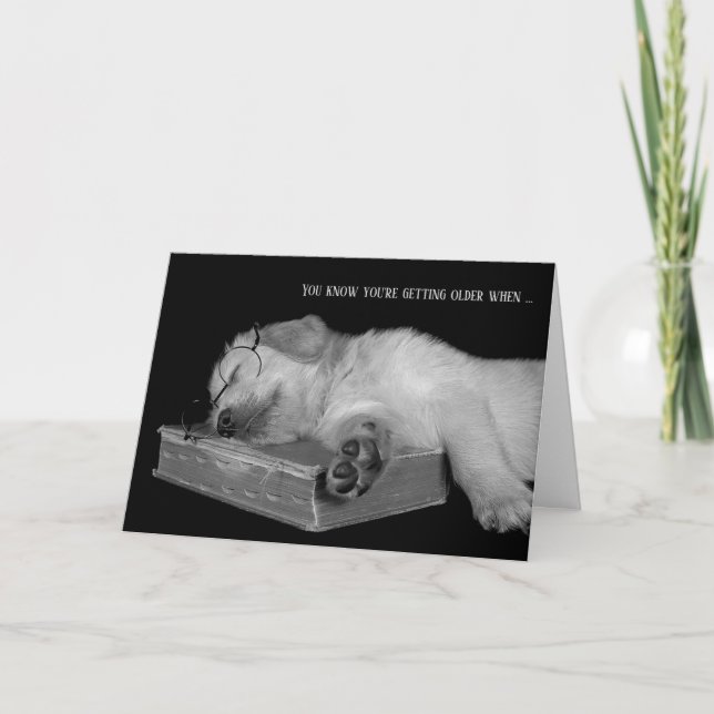 Carte chiot d'un récupérateur d'humour doré sur le livre (Devant)