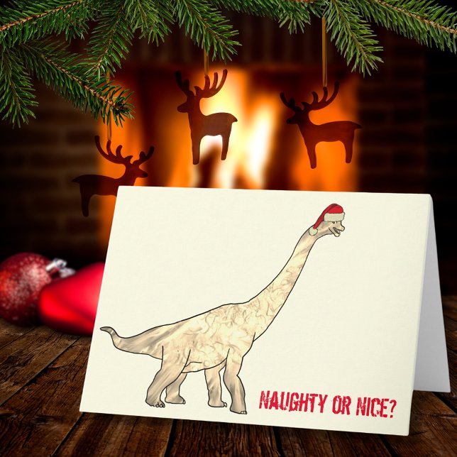 Carte Citation drôle de Noël avec un Brachiosaure en Pèr (Funny Christmas dinosaur wearing a Santa hat with naughty or nice quote)