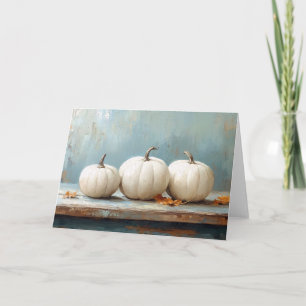 Carte Citrouilles blanches sur une table bleue vintage