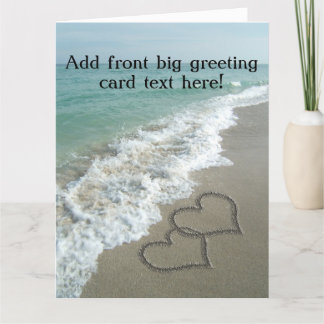 Carte Coeurs bloqués sur le sable de plage