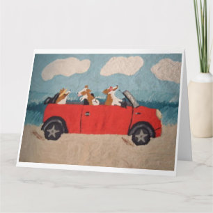 Carte Corgis gallois dans une décapotable rouge à la pla