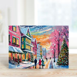 Carte Cosy Winter Street Scène Art Moderne<br><div class="desc">Un tableau d'art moderne et cosy représentant une charmante scène de rue hivernale avec des bâtiments aux couleurs vives, un sapin de Noël joliment décoré, et des gens qui se baladent dans la neige en chute libre. L'utilisation de couleurs pastel vives ajoute une touche chaleureuse et accueillante au froid de...</div>