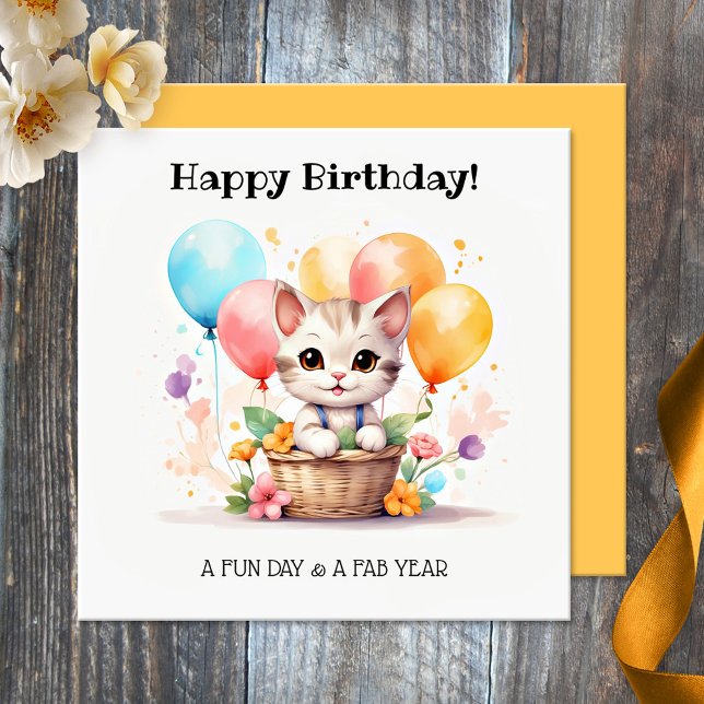 Carte Cute Kitty avec des ballons Joyeux anniversaire (Birthday card featuring a cut kitten in a basket with colorful balloons. Nice for a cat loving girl)