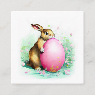 Carte D'accompagnement lapin timide caché derrière un gros oeuf de Pâques