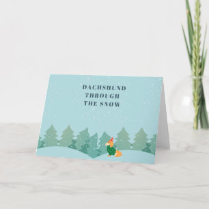 Carte Dachshund à travers la neige