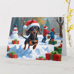 Carte Dachshund Courir en neige avec Casquette de Noël