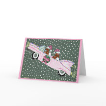 Dachshunds à Noël dans une décapotable rose