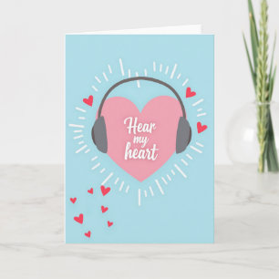 Carte d'amour avec écouteurs et cœur rose