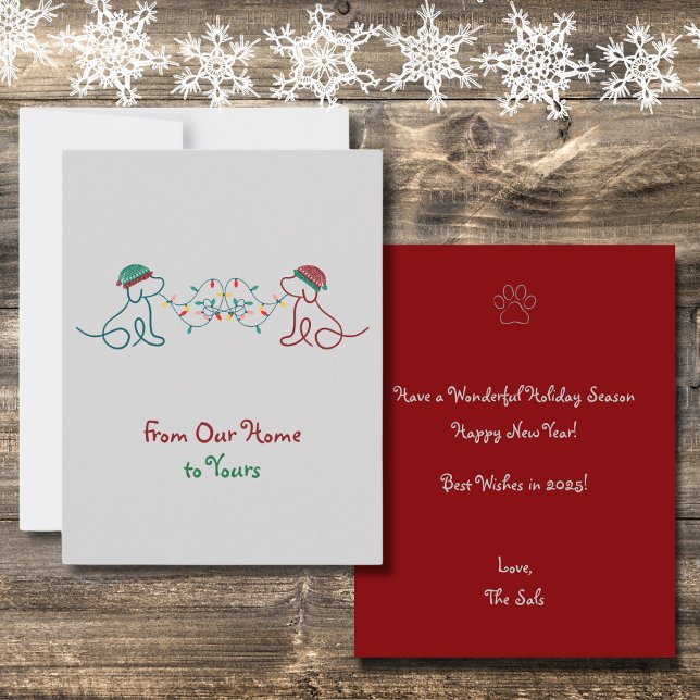 Carte De Correspondance Chiens jouant avec la fête de Noël (From Our Home to Yours. Featuring 2 cute dogs with winter hats and Christmas lights. Very Festive!)