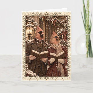 Carte de Noël avec des chanteurs de Noël cardinaux