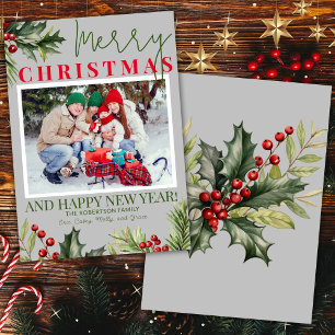 Carte de Noël grise avec houx et baies rouges Phot