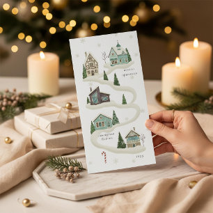 Carte de Noël hivernale avec un village enneigé