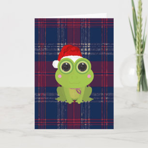 Carte de Noël mignonne de grenouille sur plaid ble