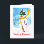 Carte de Noël mignonne galloise, Snowman et Robin<br><div class="desc">Une carte de Noël amusante avec Joyeux Noël en gallois et un robin qui a atterri sur le casquette du bonhomme de neige et profite des baies sèches. Illustration fantaisiste peinte à la main par Judy Adamson.</div>