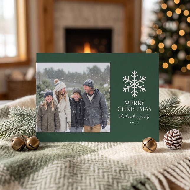 Carte de Noël Moderne Flocon de Neige - Vert (Simulated card on table)