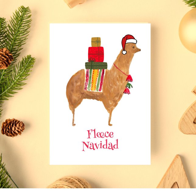 Carte de Noël pliée dessinée à la main représentan (This hand-painted Christmas llama bearing holiday gifts reads "Fleece Navidad.")