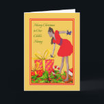 Carte de Noël pour nounou<br><div class="desc">Carte de Noël pour votre grande nourrice. Ce joli design est en or avec une jeune dame qui descend vers un paquet décoré avec un saint et un homme en pain d'épices comme une bordure de Noël en dessous du paquet. Elle porte une robe rouge avec des accents et des...</div>